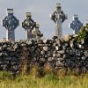 Celtic-Crosses-behind-a-stone-wall-in-Ireland.jpg