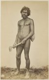 YLV1025809_Aboriginal-man-nude-carrying-a-basket-and-holding-an-axe.jpg