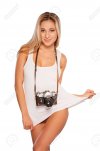26888690-photographer-beautiful-young-playful-woman-with-camera-stretching-her-tank-top-while-...jpg