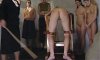 inmate secured for a caning.jpg