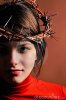 young-woman-wearing-thorn-crown-10617977.jpg