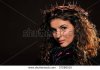 stock-photo-young-woman-wearing-crown-made-of-thorns-27266515.jpg