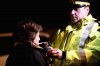 a-police-officer-takes-an-alcohol-test-to-a-372215.jpg
