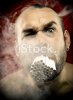 stock-photo-9171806-man-smoking-many-cigarettes-in-his-mouth.jpg