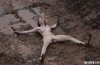 nude-woman-tied-spread-eagle-in-the-mud.jpg