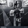 stock-photo-a-surreal-black-and-white-illustration-of-a-crucified-android-16885330.jpg