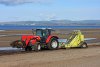 beach-tractor-pulling-sand-rake-29842315.jpg