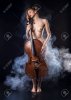 68092161-red-haired-girl-posing-nude-musician-with-cello.jpg
