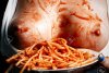 85327353-naked-breast-of-the-girl-smeared-with-ketchup-and-pasta-next-to-a-plate-of-spaghetti-...jpg