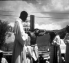 A-young-Haitian-man-follows-the-stations-of-the-cross-and-performs-the-crucifixion-for.png