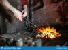 work-blacksmith-forge-holds-red-hot-metal-tongs-furnace-153681886.jpg