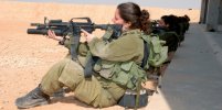 Israeli female soldiers shopping and leisure travel beach gun their hands Israeli female soldi...jpg