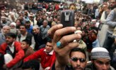 apr-15-2011-srinagar-kashmir-india-a-kashmiri-muslim-taking-a-photo-CDMWWY.jpg